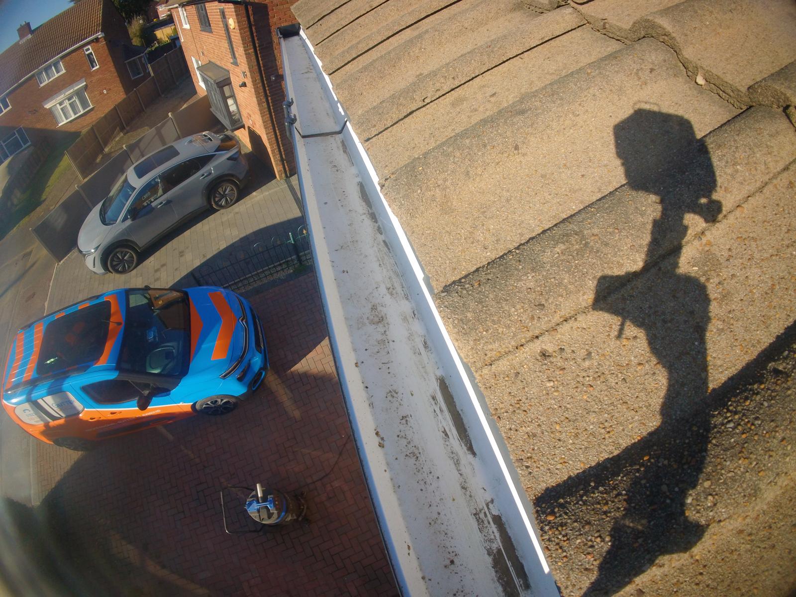 Cleared gutter running freely after ground-based vacuum clearing by Gutter Pro